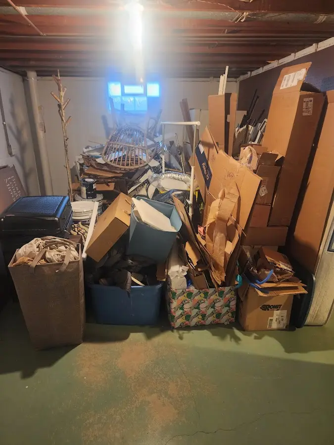 Roll-off dumpster container at job site for Yard Waste Dumpster Rental in Pequannock